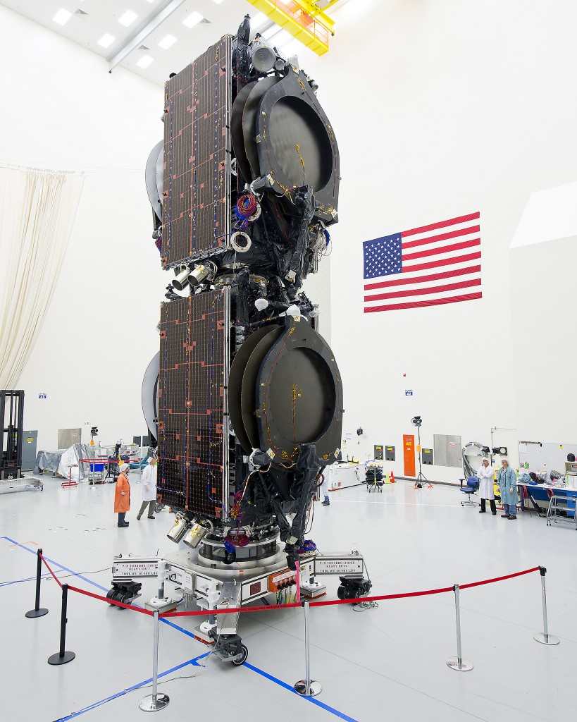 The ABS 3A satellite (top) and the Eutelsat 115 West B satellite (bottom) are stacked inside Boeing's factory in El Segundo, California. Credit: Boeing