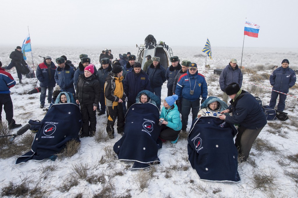 Elena Serova, Alexander Samokutyaev and Butch Wilmore recline after exiting their Soyuz spacecraft following landing. Credit: NASA/Bill Ingalls