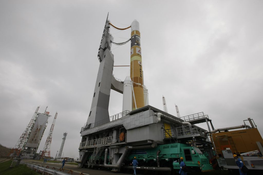 File photo of a Japanese H-2A rocket during rollout to the launch pad at the Tanegashima Space Center. Credit: JAXA