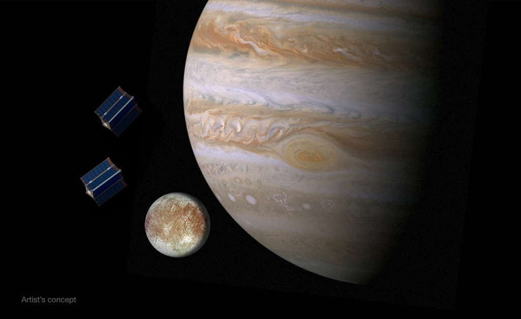 Artist's concept of CubeSats at Jupiter and Europa. NASA awarded funding to 10 university teams last year to study CubeSat proposals that could be carried to Europa. Credit: NASA/JPL-Caltech