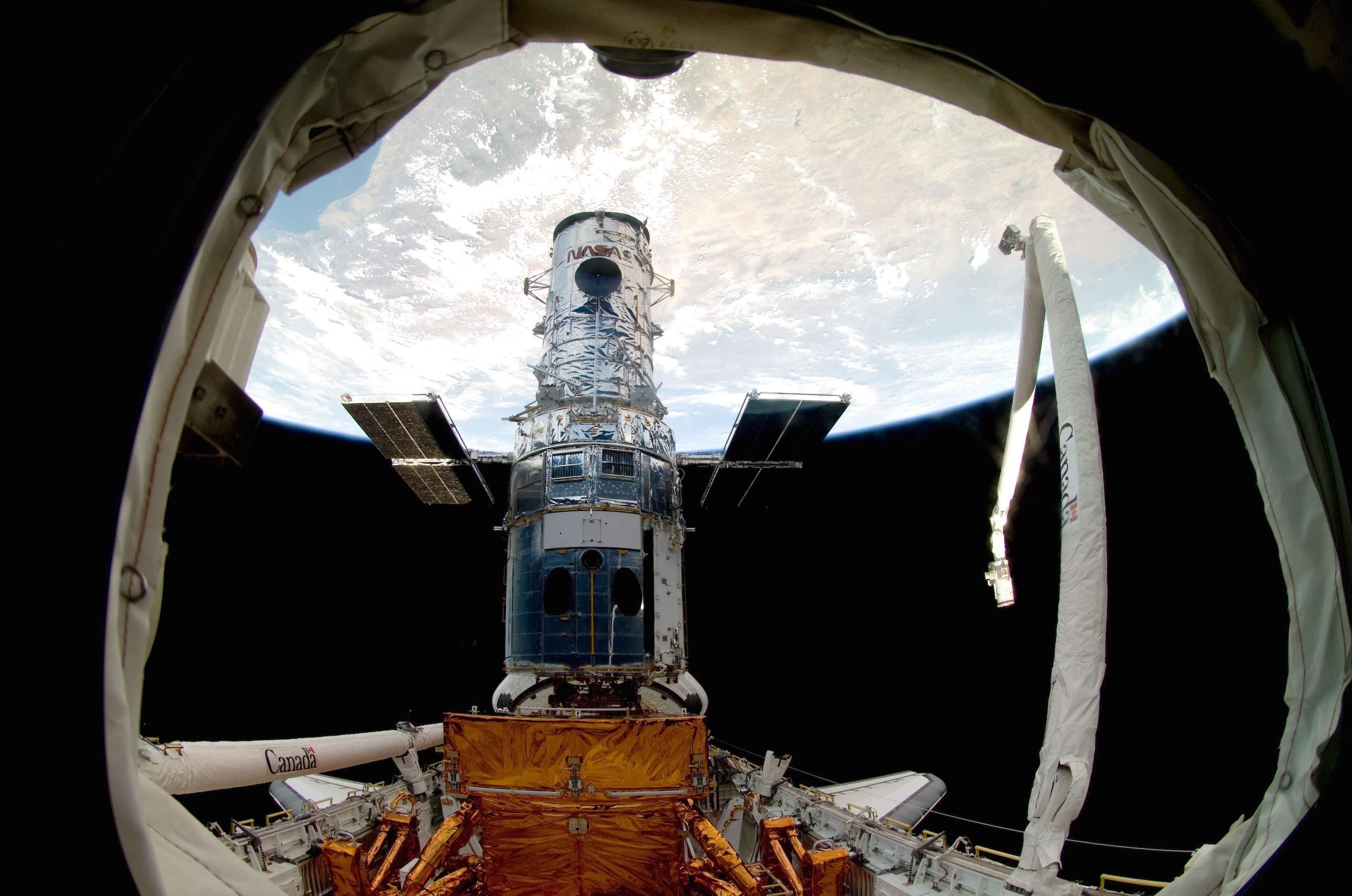 space shuttle through telescope