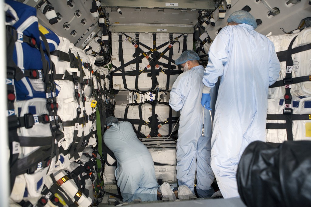 Technicians load Cygnus for launch. Credit: NASA-KSC