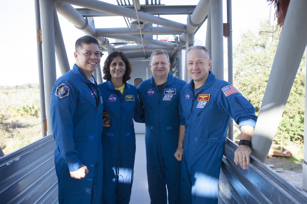 Behnken, Williams, Boe and Hurley survey the Atlas crew access arm. Credit: NASA