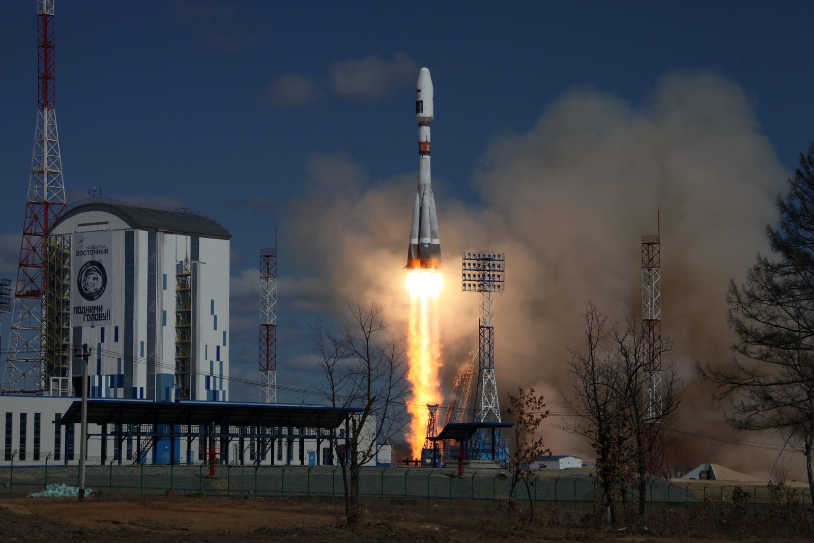 Rocket launch from cosmodrome. Fight of space rocket in blue sky