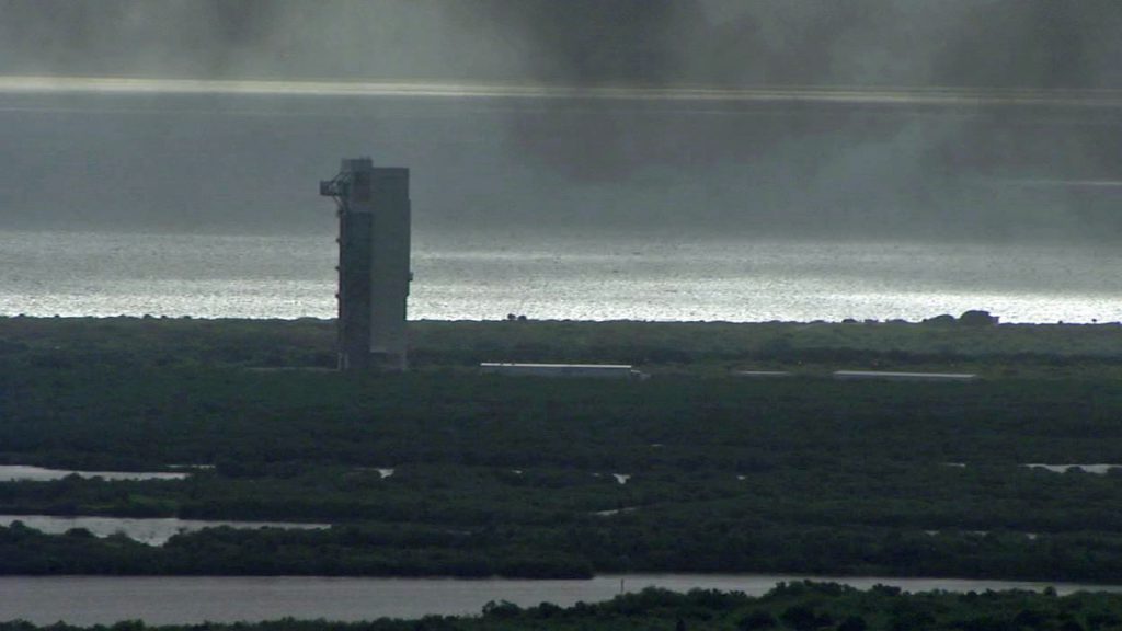 Black smoke hangs in the air at the Atlas 5 rocket's assembly building Thursday morning.