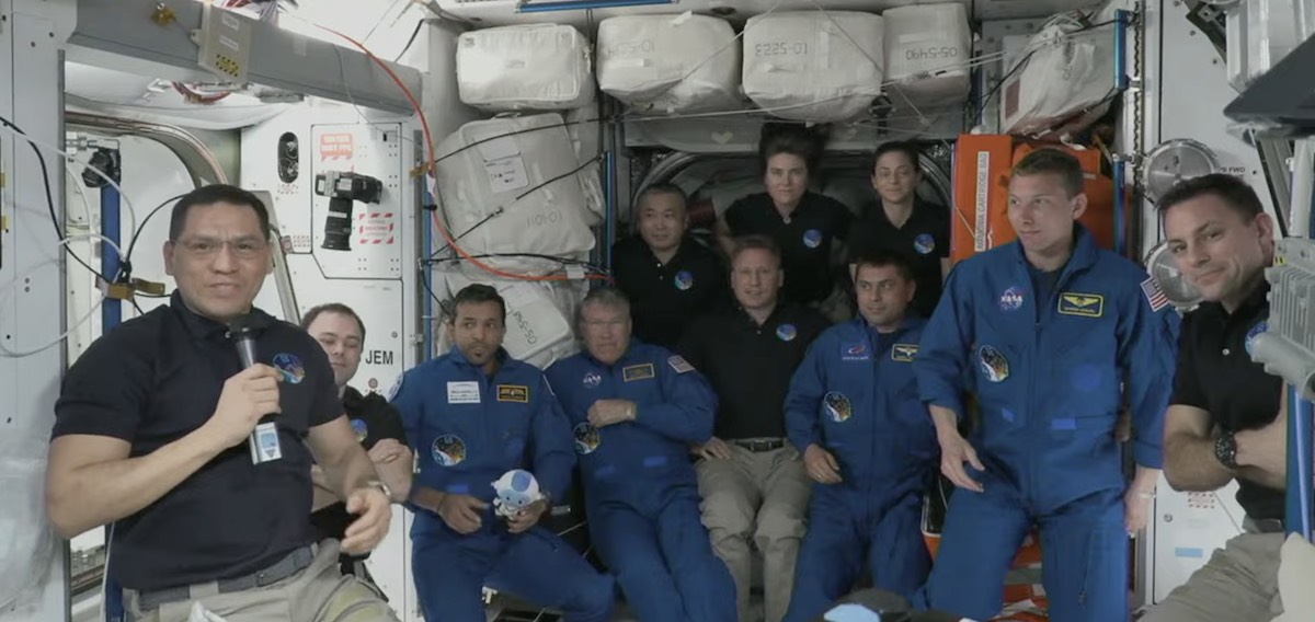 SpaceX capsule docks at space station with multinational crew thumbnail