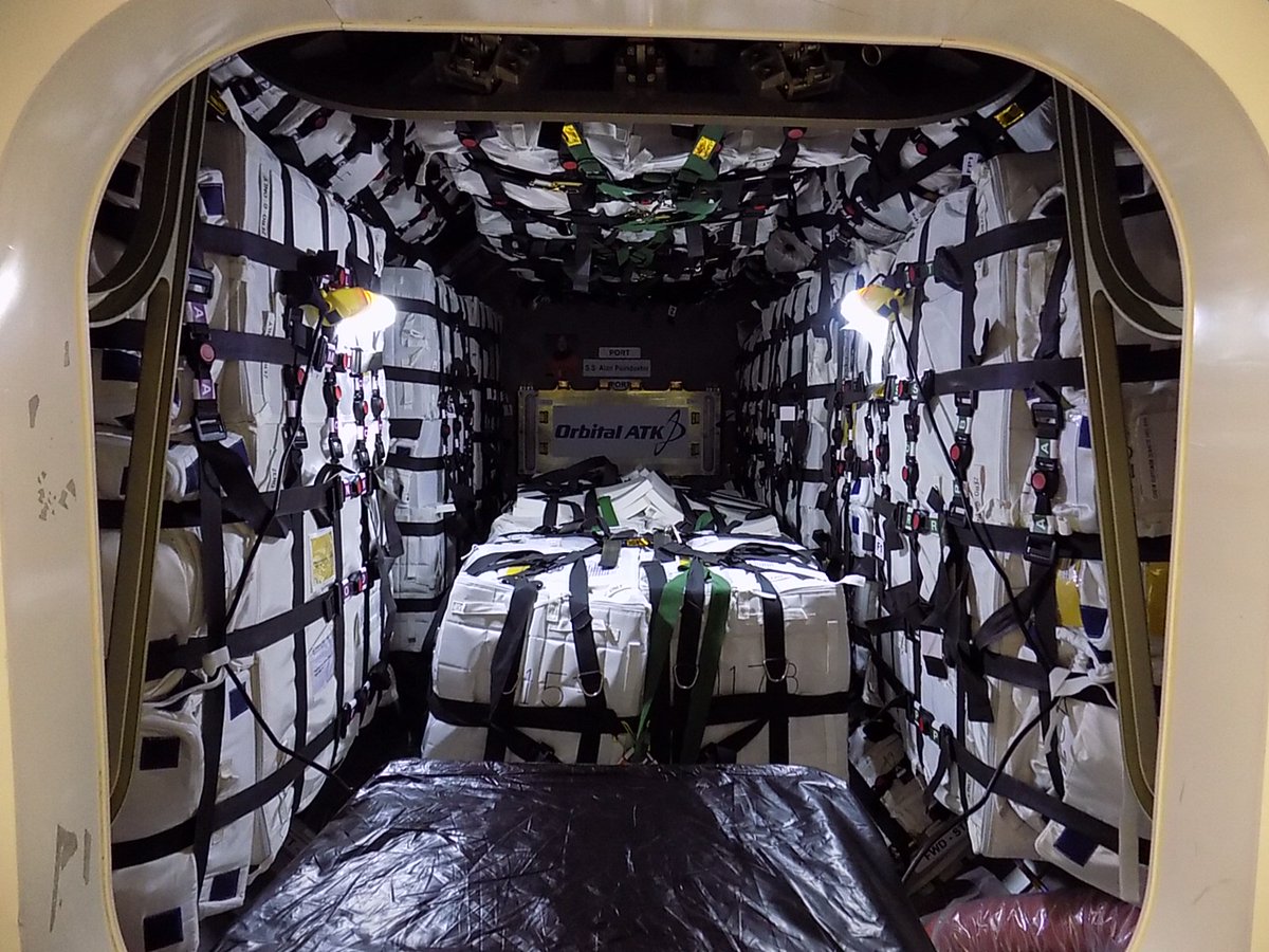 A view inside the pressurized cargo module of Orbital ATK's Cygnus spacecraft after technicians loaded the final supplies heading for the International Space Station. Credit: Orbital ATK