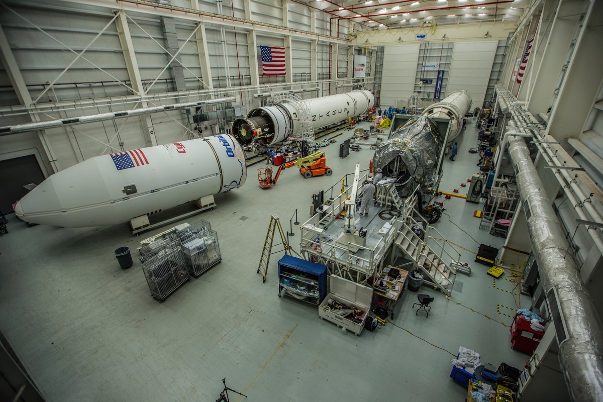 A view of the Antares rocket (left) undergoing final preparations for this week's launch. Credit: Orbital ATK