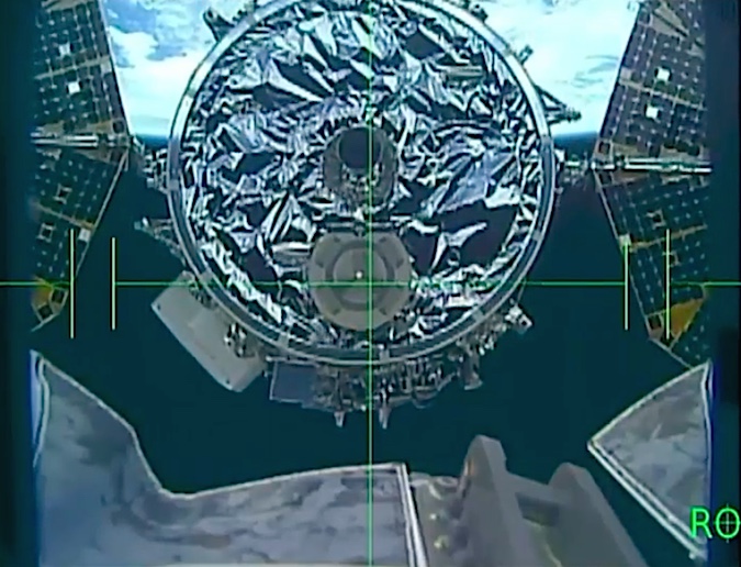 This view from a camera on the robot arm's end effector shows the aft end of the Cygnus supply ship during the final stages Sunday's rendezvous. Credit: NASA TV/Spaceflight Now