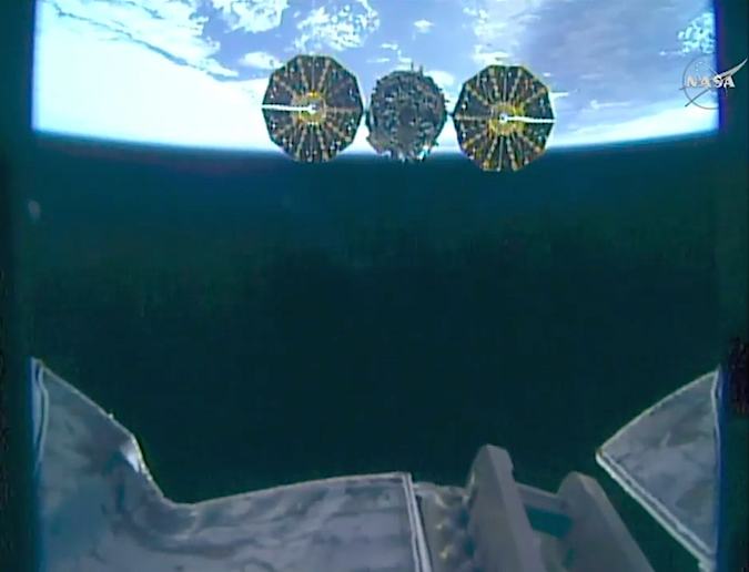 This view from the robot arm's end effector shows the Cygnus spacecraft departing the space station Monday. Credit: NASA TV/Spaceflight Now