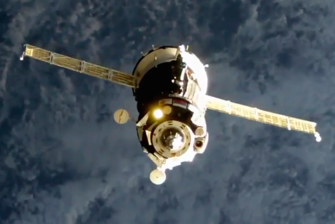 Live coverage: Veteran three-man crew docks with space station