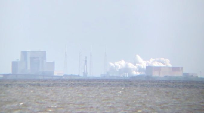 A plume of exhaust erupted from the Falcon 9's launch pad as the rocket test-fired its engines at 10 a.m. EDT (1400 GMT) Wednesday. Credit: William Harwood/CBS News