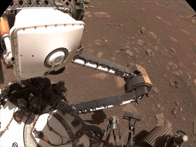 This view from the Perseverance rover's navigation cameras shows the "Mars 2020" and "Perseverance" name plates on the vehicle's robotic arm. Credit: NASA/JPL-Caltech