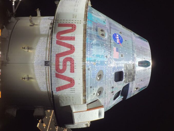 A camera mounted on the trip of one of the Orion spacecraft's solar array wings captured this view of the capsule during an exterior survey Nov. 18. Credit: NASA