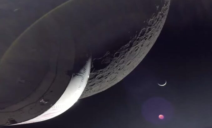 The Orion spacecraft captured this stunning view of a crescent Earth and the limb of the moon after completing the return powered flyby maneuver for the Artemis 1 mission Monday. Credit: NASA TV / Spaceflight Now