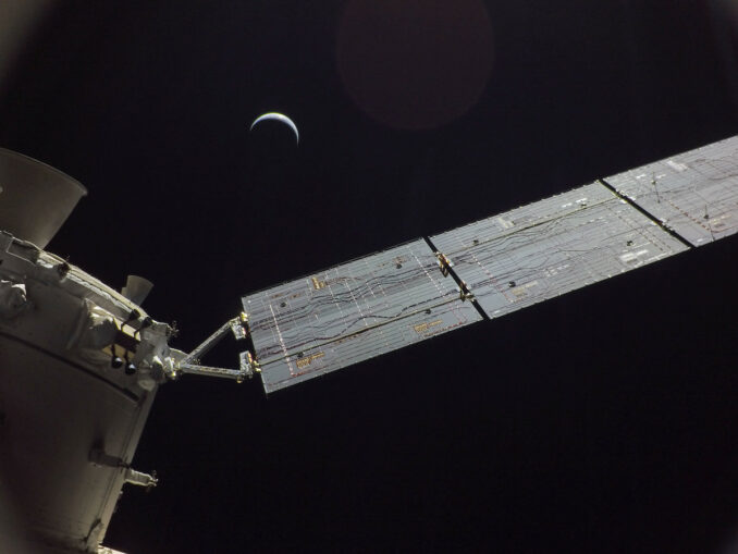 A camera on one of the Orion spacecraft's four solar array wings captured this view of a crescent Earth on Saturday, Dec. 10, the Artemis 1 mission's final full day in space. Credit: NASA