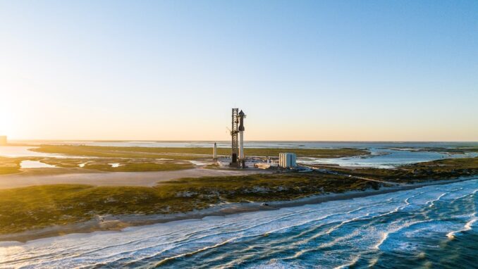SpaceX's Starship rocket stands fully stacked near the shoreline of Texas at its Starbase facility on Oct. 20, 2023. On Oct. 31, the FAA said it concluded its safety review ahead of its second test flight. Image: SpaceX