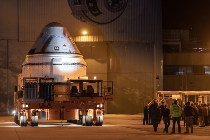 The CST-100 Starliner spacecraft pauses in front of Boeing's Commercial Crew and Cargo Processing Facility (C3PF) before it embarks to Space Launch Complex 41 (SLC-41) at Cape Canaveral Space Force Station. Image: Adam Bernstein/Spaceflight Now
