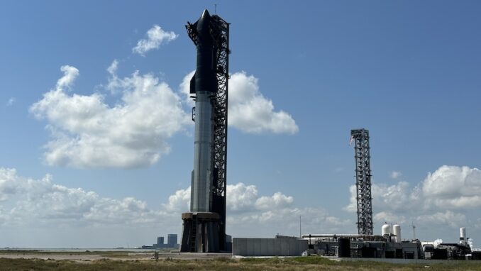 SpaceX's fully stacked Starship rocket stands atop the Orbital Launch Mount at Starbase in southern Texas. The Starship Flight 5 mission is poised to feature the first booster catch using the arms of the launch tower. Image: Will Robinson-Smith/Spaceflight Now